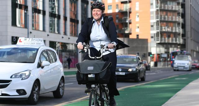 Cyclist on bike lane in Leeds