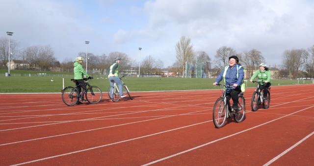 Andrea laughing on Bike.jpg