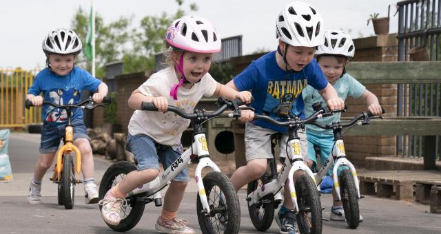 Group of four children on balance bikes © Gibson Digital 2022