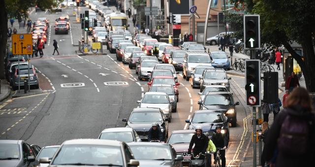 Congested road with pedestrians and cyclists 