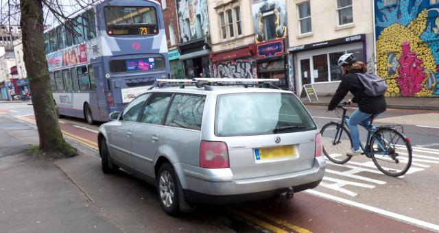 A car is parked in a mandatory cycle lane. Photo by Sam Saunders