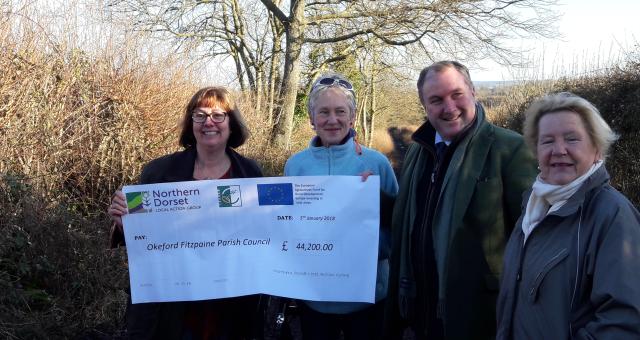 Cheque being handed over to fund the work on Little Lane