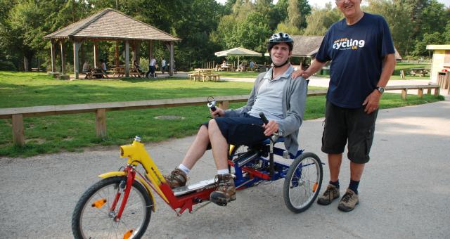 Recumbent rider with volunteer