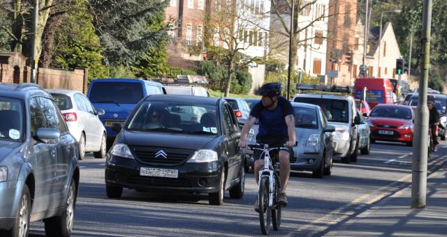 Cyclist riding on road