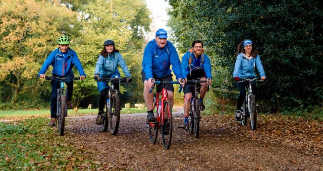 Cyclists riding in autumn