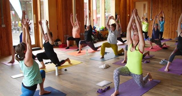 Cyclists practising yoga 