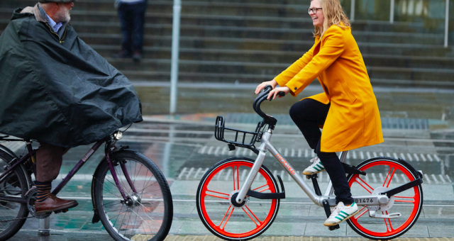 Helen Pidd riding a Mobike in the rain