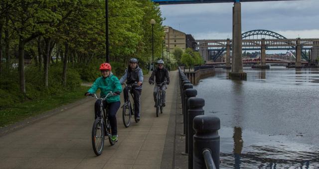 A group ride along a river  Photo by Stewart Prince