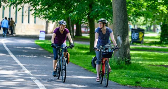 Women cycling to work