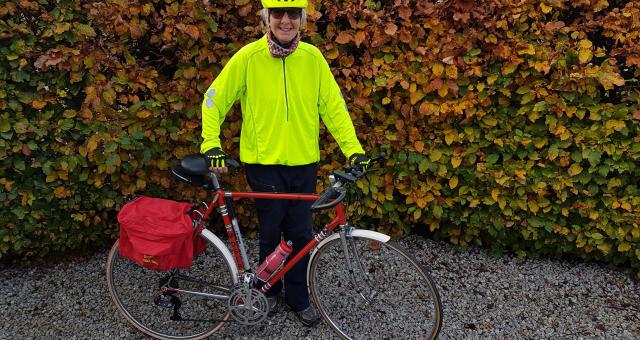 Woman standing with bike