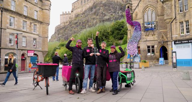 Employees of Farr Out Deliveries holding their award in Edinburgh