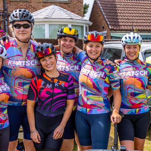 Elle stands with her teammates and one of the organisers at Seacroft Wheelers Road Race. She is fifth from the left, third from the right. She is wearing Klatsch club cycle kit. 